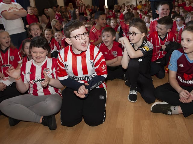 Young Steelstown Primary School Pupils gets excited during the visit of Derry City players Shane and Patrick McEleney and Michael Duffy on Tuesday. (Photos: Jim McCafferty)