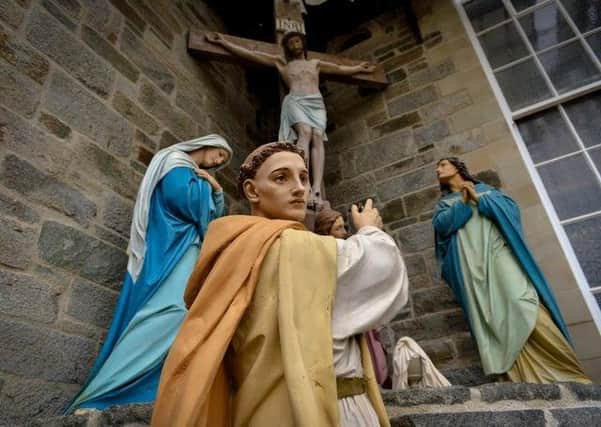 The statue of St ColmCille at St Columba's Church, Long Tower.