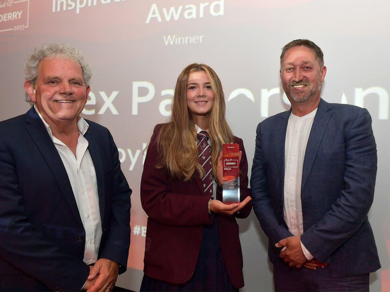 Inspirational Young Person of the Year Award winner Alex Patterson, Foyle College, receives his trophy from Steve Frazer, managing director, City of Derry Airport, on the right, and compere Adrian Logan.  Photo: George Sweeney. DER2325GS – 55