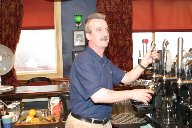 Serving drinks at The Derby Bar in 2004.