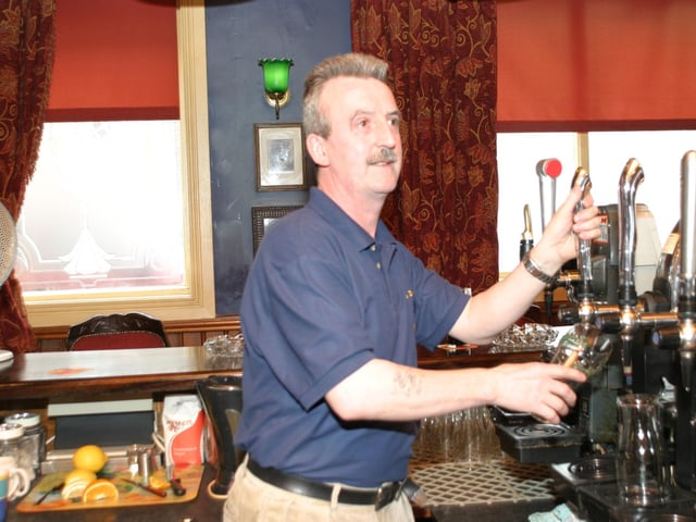 Serving drinks at The Derby Bar in 2004.