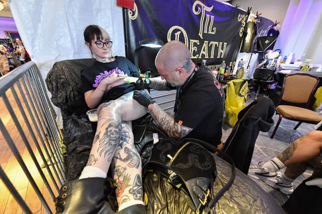 Tattoo artists at the annual Maiden City Ink International Tattoo Convention held in the Everglades Hotel. Photo: George Sweeney