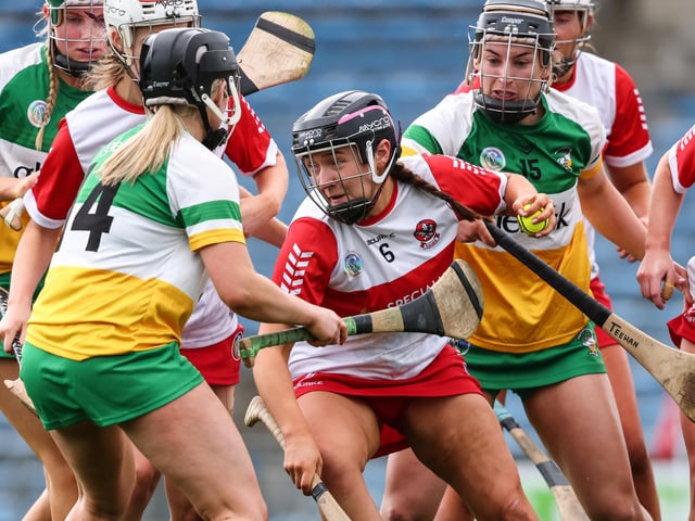 Derry's Niamh Quinn with Mairead Teehan of Offaly in Thurles. (Photo: INPHO/Ben Brady)