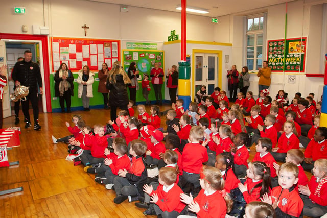 A big cheer for Derry City players Shane McEleney and Joe Thompson as they bring the FAI Cup to St. Eugene’s PS on Monday morning.