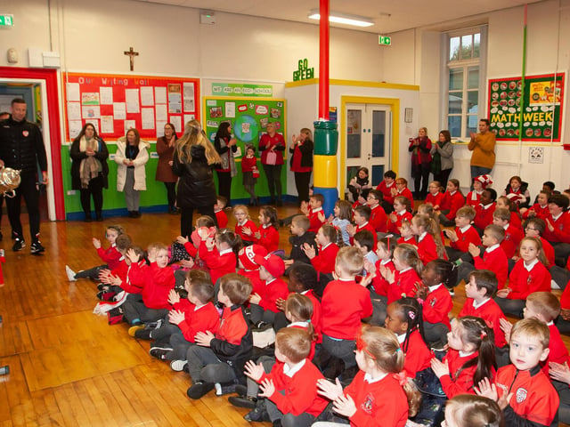 A big cheer for Derry City players Shane McEleney and Joe Thompson as they bring the FAI Cup to St. Eugene’s PS on Monday morning.