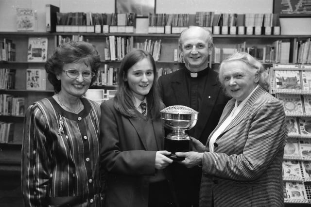 Dr. Vera Furness, guest speaker, presenting the AIB Trophy for best GCSE results to Gillian Doherty. Included, Miss Geraldine Keegan, principal, and Fr. Brian Brady, BoGs.