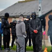 Masked youths with petrol bombs in Creggan on Monday afternoon.  Photo: George Sweeney