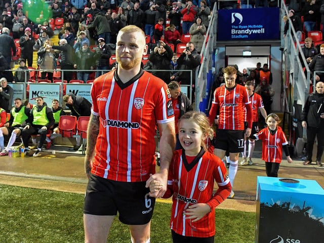Delighted young mascot pictured with Derry City’s Mark Connolly at the Brandywell on Friday evening. Photograph: George Sweeney