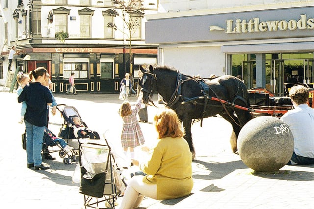 Child pats horse at Waterloo Place in 1997. Hugh Gallagher