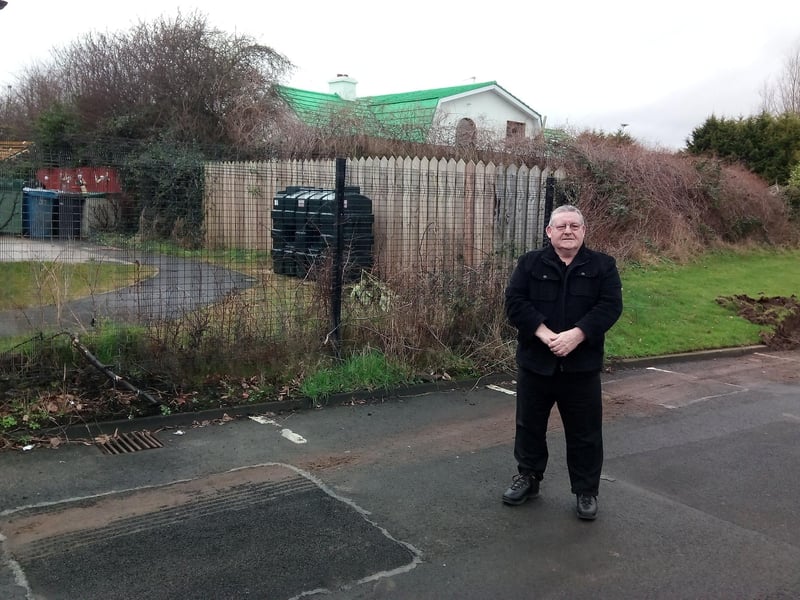 Councillor Tony Hassan has called for the Housing Association to state when they plan to build the wall.