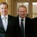 Britain's Prime Minister Tony Blair (L) walks inside 10 Downing Street with leader of Sinn Féin Gerry Adams (R) and Sinn Féin Chief Negotiator Martin McGuinness (C) before talks in London, 04 August 2005. (Photo by MIKE FINN-KELCEY/POOL/AFP via Getty Images)