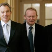 Britain's Prime Minister Tony Blair (L) walks inside 10 Downing Street with leader of Sinn Féin Gerry Adams (R) and Sinn Féin Chief Negotiator Martin McGuinness (C) before talks in London, 04 August 2005. (Photo by MIKE FINN-KELCEY/POOL/AFP via Getty Images)