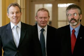 Britain's Prime Minister Tony Blair (L) walks inside 10 Downing Street with leader of Sinn Féin Gerry Adams (R) and Sinn Féin Chief Negotiator Martin McGuinness (C) before talks in London, 04 August 2005. (Photo by MIKE FINN-KELCEY/POOL/AFP via Getty Images)
