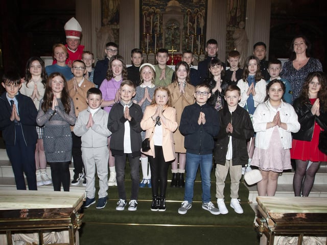 Pupils from Nazareth House PS who received the Sacrament of Confirmation from Rev. Dr. Donal McKeown at St. Columba’s Church, Long Tower on Thursday evening last. Included is Mrs. Roisin Blackery, Principal and Mrs. Joanna Higgins, teacher. (Photo: Jim McCafferty Photography)