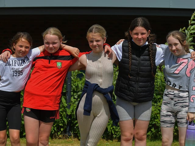 Friends enjoy the sunny weather and games at the Holy Child Primary School sports day held on Monday last. Photo: George Sweeney. DER2325GS – 009