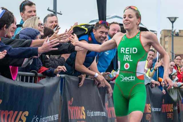 Derry Olympian Aileen Reid celebrates with the crowd after the Rio bound triathlete won the Women's Category 1 Firmus Energy Triathlon in her home city in 2016. Picture Martin McKeown