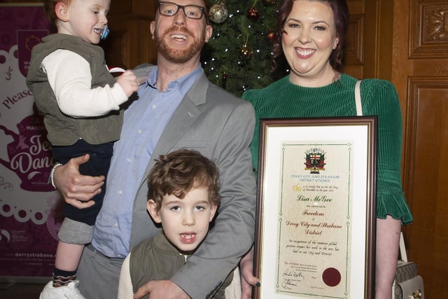 Derry Girls writer Lisa McGee pictured with her husband and sons after being awarded the Freedom of the City on Monday evening at the Guildhall.