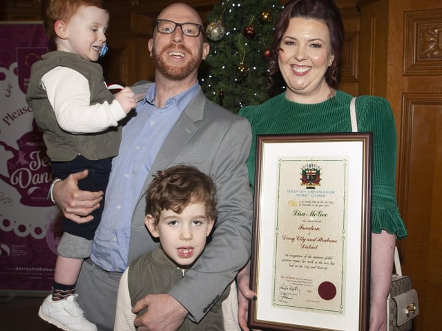 Derry Girls writer Lisa McGee pictured with her husband and sons after being awarded the Freedom of the City on Monday evening at the Guildhall.