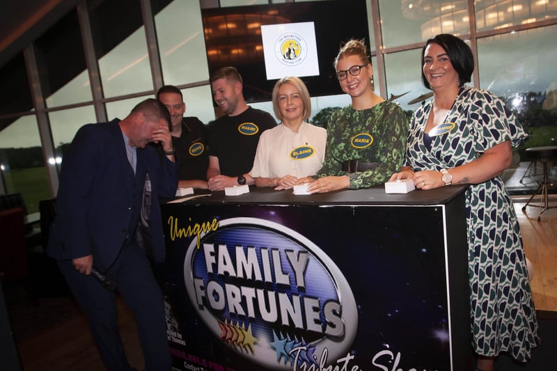 OH DEAR!. . . .Quizmaster Conga McBride accepts an ‘answer’ from the No Booze Babes on Friday night. From left, David Nash, Ruairi Friel, Elaine Breslin, Maria Nash and Joanne Nash.