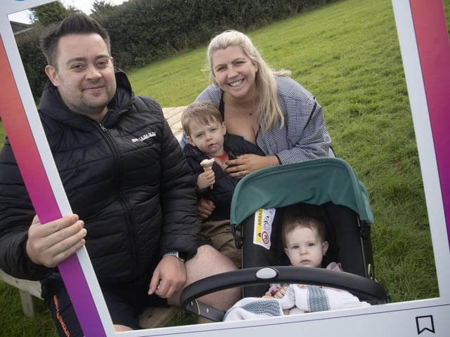 One of the families poses for a photo during Saturday's Waterside Festival. : .
