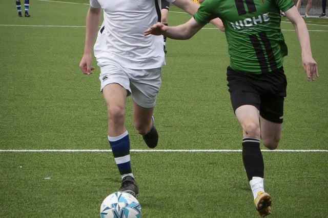 Tommie McLaughlin attempts to lose his marker during the second period of Friday’s u-16 final.