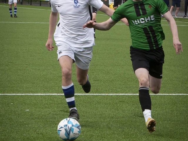 Tommie McLaughlin attempts to lose his marker during the second period of Friday’s u-16 final.
