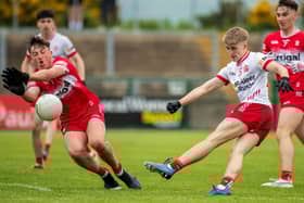 Derry’s James Sargent blocks a shot from Peter McGoldrick of Tyrone. Photo: George Sweeney