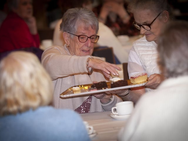 Enjoying a pastry at the Mayor's Tea Dance.