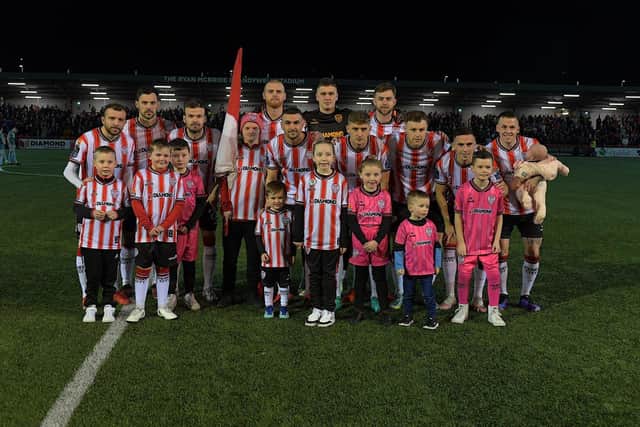 Mascots pictured with the Derry City starting eleven against Drogheda. Photograph: George Sweeney