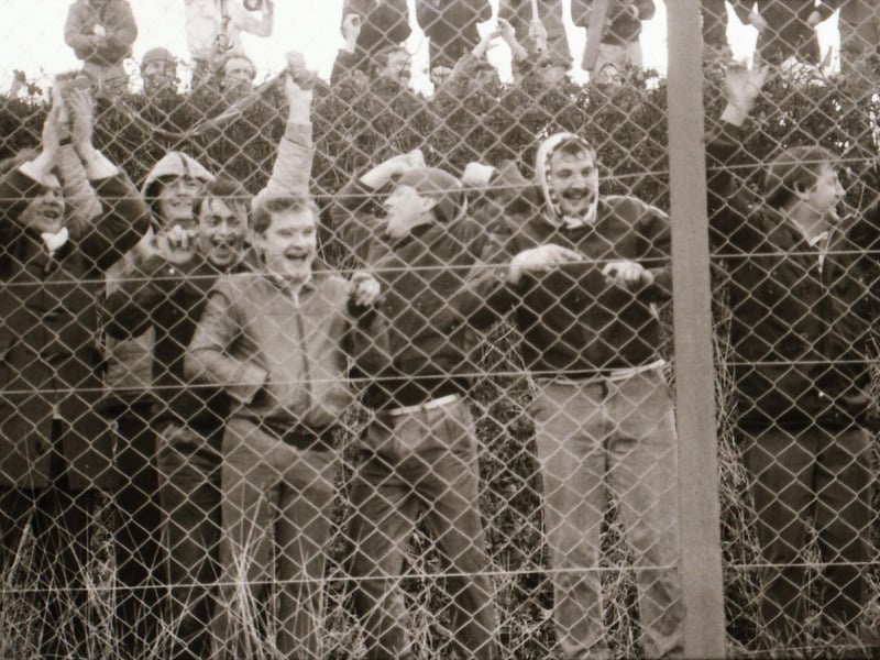 Derry City in action as fans watch on.