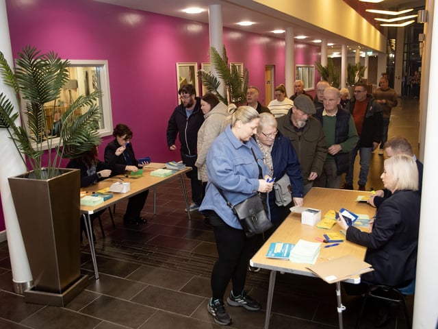 Queuing at St. Mary's College on Monday night for the Derry Credit Union AGM. : .