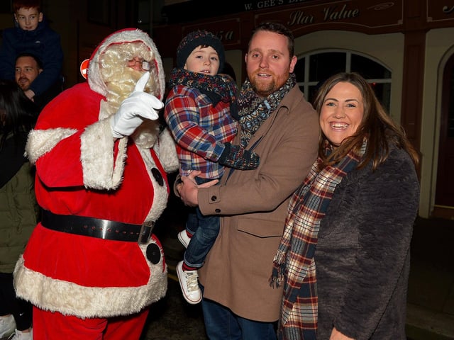 Gary Middleton MLA, his wife Julie and son David pictured with Santa at the Derry Christmas Lights parade in 2021. Photo: George Sweeney.  DER2147GS – 019