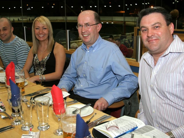 Darren, Emma, Fred and Dave study the form at the Lifford Stadium 0009JML : Parties and nights out in March 2006