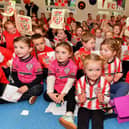 Pupils from Gaelscoil Eadain Mhoir pictured during the visit from Derry City players Ciaran Coll and Pat Hoban. Photo: George Sweeney