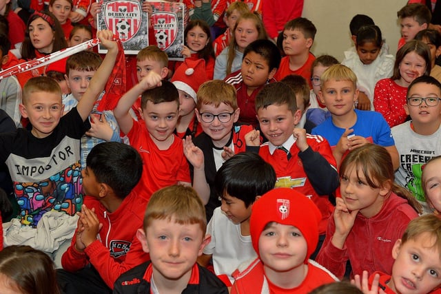 Pupils from Good Shepherd Primary School gave a rapturous welcome to Derry City players Mark Connolly, Liam Mullan and Jack Lemoignan during a visit to the school, with the FAI Cup, on Friday afternoon. Photo: George Sweeney. DER2247GS – 85