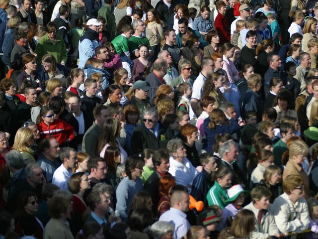 Some of the large crowd who thronged to the Guildhall Square in a glorious St. patrick's Day .  91803Jb15):.