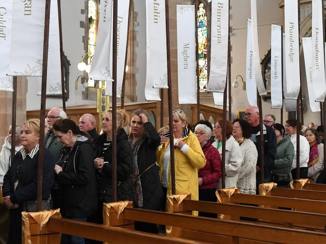 People queue for the veneration of the relics of St Bernadette at St Eugene's Cathedral on Monday morning. Relics of the saint are being taken on pilgrimage to each of the 26 Catholic dioceses in Ireland. Photo: George Sweeney