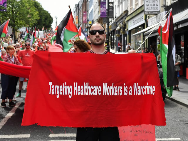Banner carried at the ‘Turn Shipquay Street Red for Gaza’ march on Saturday afternoon. Photo: George Sweeney