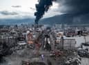 HATAY, TURKEY - FEBRUARY 07: Smoke billows from the Iskenderun Port as rescue workers work at the scene of a collapsed building on February 07, 2023 in Iskenderun, Turkey. A 7.8-magnitude earthquake hit near Gaziantep, Turkey, in the early hours of Monday, followed by another 7.5-magnitude tremor just after midday. The quakes caused widespread destruction in southern Turkey and northern Syria and were felt in nearby countries.  (Photo by Burak Kara/Getty Images)
