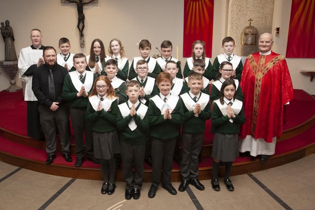 Pupils from Mr. Christopher Martin’s  class at Greenhaw Primary School who received the Sacrament of Confirmation from Fr. John Farren at St. Brigid’s Church, Carnhill on Monday afternoon last. On left is Fr. Sean O’Donnell. (Photo: Jim McCafferty Photography)