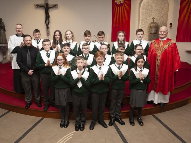 Pupils from Mr. Christopher Martin’s class at Greenhaw Primary School who received the Sacrament of Confirmation from Fr. John Farren at St. Brigid’s Church, Carnhill on Monday afternoon last. On left is Fr. Sean O’Donnell. (Photo: Jim McCafferty Photography)