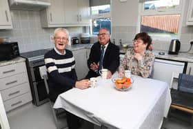The heart of the home…Delighted tenants Alan and Charlotte Donnell welcome Eddie Doherty, Housing Executive West Area Manager (middle) into their beautiful home.