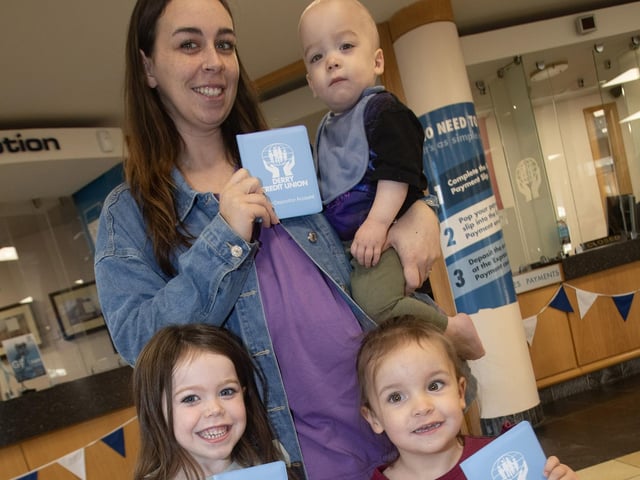 IT PAYS TO SAVE!. . . .Mum Marianne Wray and family at the Derry Credit Union celebrations on Saturday. : .