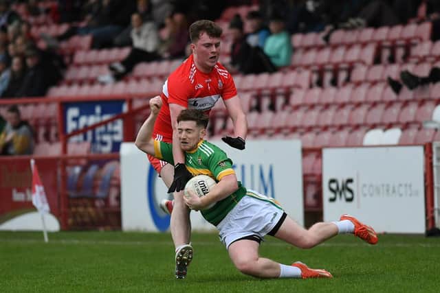 Foreglen's Caolan O'Connor is bundled to the ground by Drumsurn's Michael McCloskey. Photo: George Sweeney