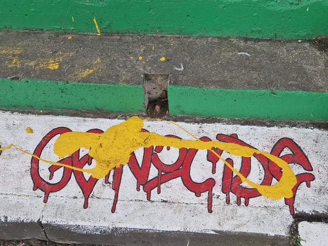 A slogan at the foot of the steps declaiming ‘if you don't like GRAFFITI look away like you do for GENOCIDE’ was partly concealed with the word ‘GENOCIDE’ partly erased by the vandals.