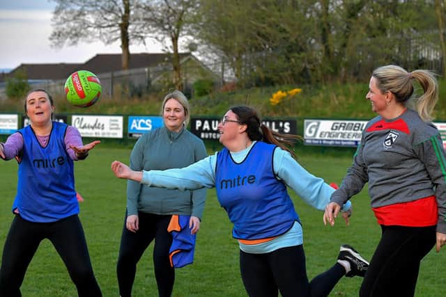 Action from Doire Trasna’s first Mothers and Others football practice session, at Corrody Road. Photo: George Sweeney. DER2316GS – 14