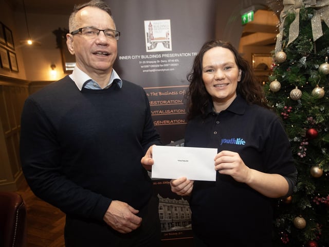 Steven Lindsay, Inner City Trust, pictured handing over a cheque to Caroline Temple, Youthlife, at the Bishop's Gate Hotel, Derry on Thursday afternoon last. The event was part of the Inner City Trust's Annual Charity Giving. (Photos: Jim McCafferty Photography)