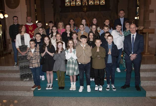 Pupils from Rosemount PS who received the Sacrament of Confirmation from Fr. Paul Farren at St. Eugene’s Cathedral on Friday last. Included is Mr. Paul Bradley, Principal, Mr. Quinn, teacher, Mrs. Stewart, Ms. Friars and Mr. Doherty. (Photo: Jim McCafferty Photography)