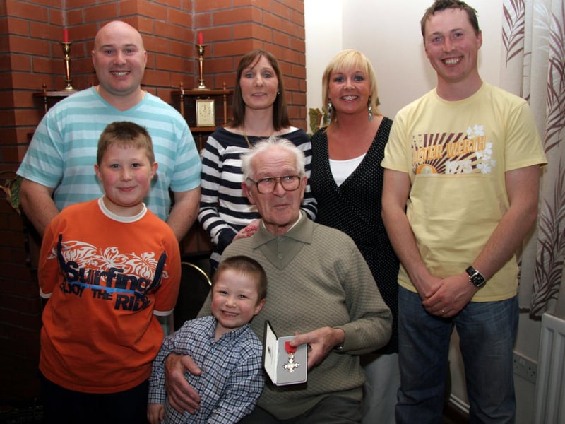 Grandchildren, Gerard, Barbara, Bronagh, Paul, Jonathan and Brian congratulate their grandfather on his M.B.E. 0619 JML