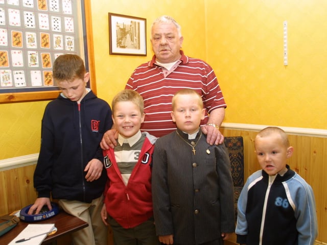 Scott, Liam Declan, and James, with Jimmy Rochford (grandad) at the First Communion celebrations.
